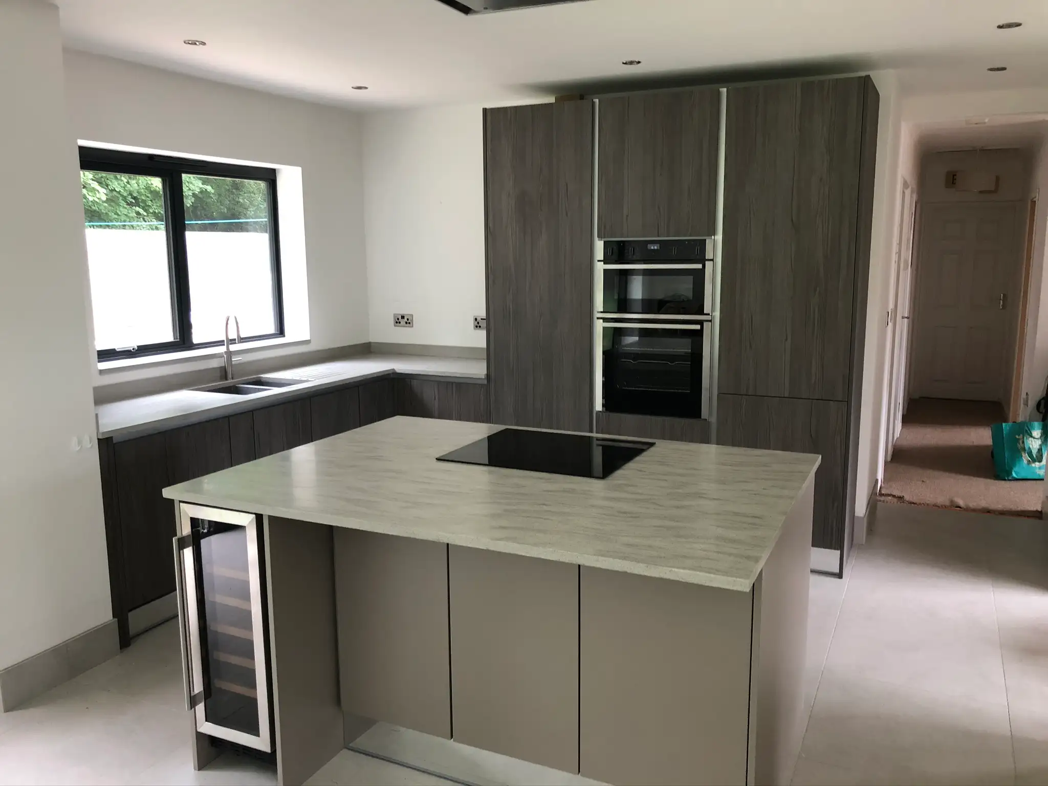 Fitted kitchen with island, wine cooler and double ovens