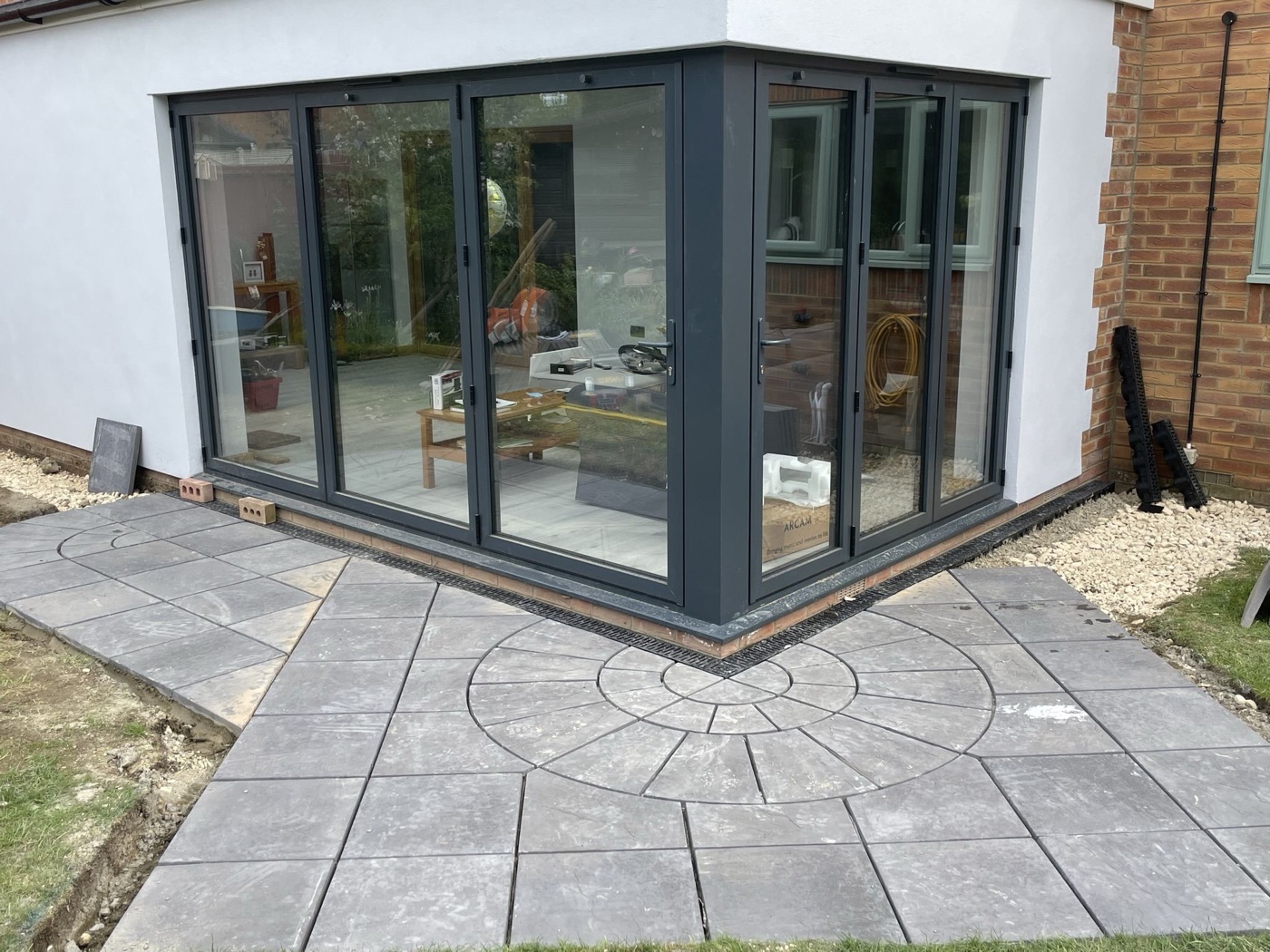 Bifold doors onto a finished patio by Ablewood