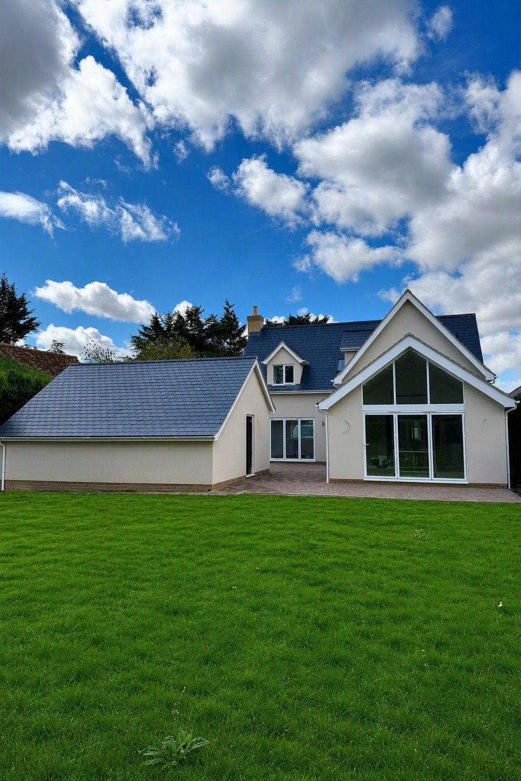 New build with a glazed gable and lawn by Ablewood
